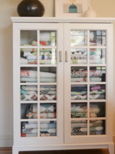 Quilt cabinets with glass outlet doors