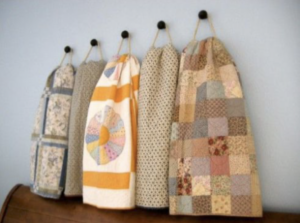 Quilts displayed on hooks